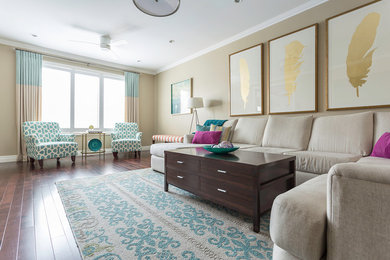 Large traditional open plan living room in Toronto with beige walls, medium hardwood flooring, no fireplace and a wall mounted tv.