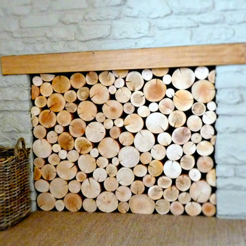 Empty Fireplace with Wood Mantle Filled WIth Display Logs