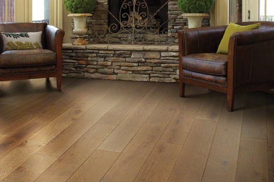 Mountain style brown floor living room photo in Grand Rapids