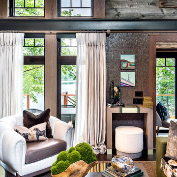 Exposed metal beams bring an industrial quality to this rustic modern lake house