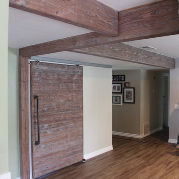 Exposed wood beams with barn door