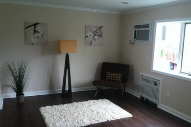 Inspiration for a timeless dark wood floor living room remodel in New York with white walls