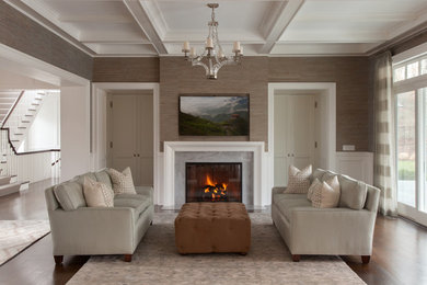 Example of a large trendy enclosed dark wood floor living room design in Phoenix with a stone fireplace, brown walls, a standard fireplace and a wall-mounted tv