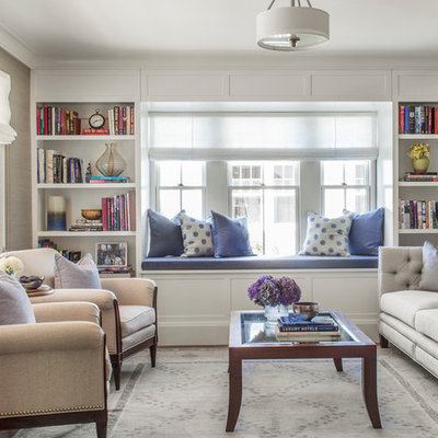 Example of a mid-sized classic formal and enclosed medium tone wood floor living room design in Boston with beige walls