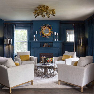 Example of a mid-sized transitional formal and enclosed dark wood floor living room design in Denver with blue walls, no tv and a standard fireplace