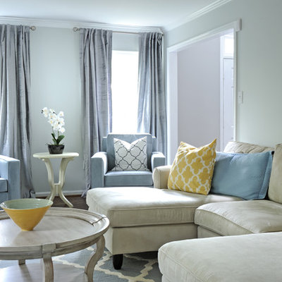Example of a transitional living room design in DC Metro with blue walls