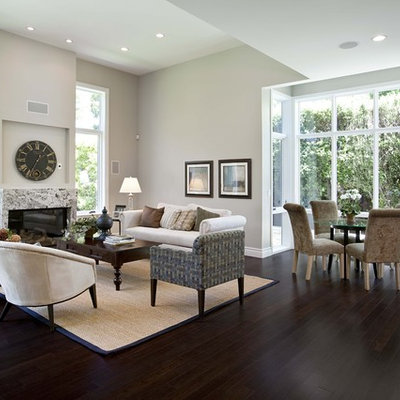 Living room - contemporary open concept dark wood floor and brown floor living room idea in San Francisco with gray walls, a standard fireplace, a stone fireplace and no tv