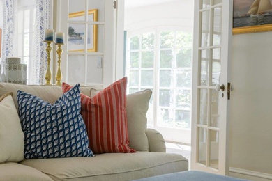 Elegant open concept living room photo in Boston with beige walls