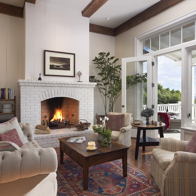 Living room - mid-sized traditional living room idea in Santa Barbara with a standard fireplace and a brick fireplace