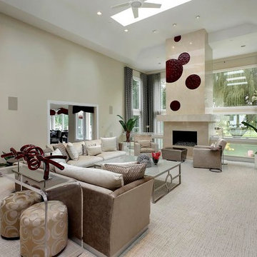 Family Room with Freestanding Fireplace, Acrylic Sofa Table and Red Accessories