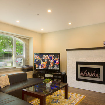 Family Room With Large Transitional Fireplace