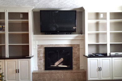 Photo of a medium sized living room in Louisville with beige walls, a standard fireplace, a stone fireplace surround and a built-in media unit.