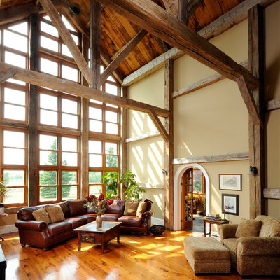 Inspiration for a country formal and enclosed medium tone wood floor and orange floor living room remodel in Ottawa with beige walls