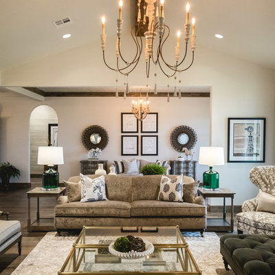 Inspiration for a large farmhouse open concept medium tone wood floor living room remodel in Oklahoma City with white walls, a standard fireplace and a stone fireplace