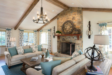 Example of a mid-sized farmhouse formal and enclosed dark wood floor and brown floor living room design in Other with beige walls, a standard fireplace, a stone fireplace and no tv