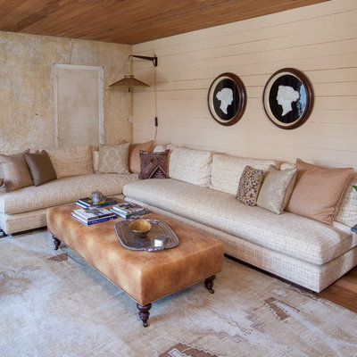 Inspiration for a country formal and enclosed medium tone wood floor living room remodel in Charleston with beige walls