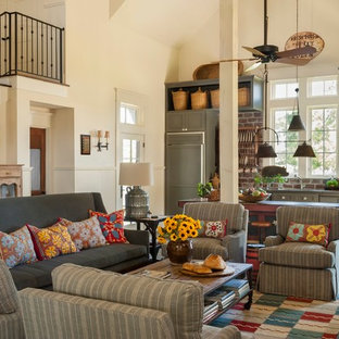 Example of a cottage formal and open concept concrete floor living room design in Houston with beige walls and no fireplace