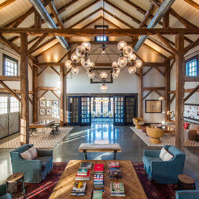 Example of a huge country open concept living room design in Dallas with gray walls
