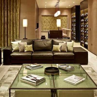 Inspiration for a contemporary open concept living room remodel in London with beige walls and no tv