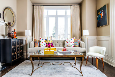 Example of a mid-sized eclectic open concept dark wood floor living room design in Toronto with beige walls