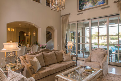 This is an example of a medium sized mediterranean formal open plan living room in Phoenix with beige walls, marble flooring, no fireplace and no tv.