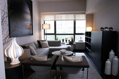 Inspiration for a contemporary dark wood floor living room remodel in New York with beige walls