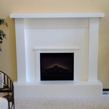 Fireplace front with electronic equipment storage