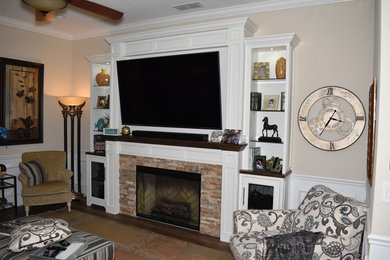 Example of a mid-sized classic living room design in Jacksonville with a stone fireplace