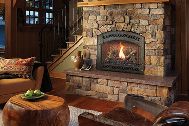 Example of a classic living room design in Boston with a standard fireplace and a stone fireplace