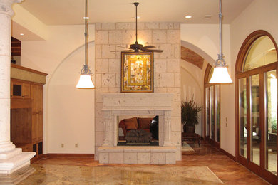 ヒューストンにある広いおしゃれなLDK (ベージュの壁、テラコッタタイルの床、両方向型暖炉、石材の暖炉まわり) の写真
