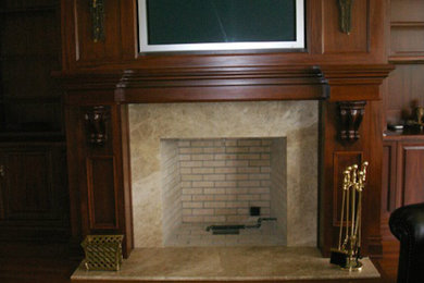 Inspiration for a living room remodel in New York with a standard fireplace, a tile fireplace and a wall-mounted tv