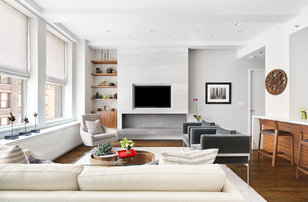 Example of a trendy open concept dark wood floor and brown floor living room design in New York with gray walls and a ribbon fireplace