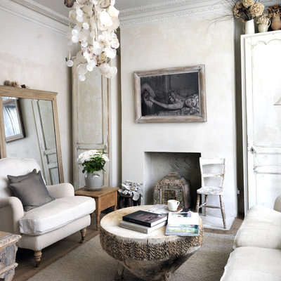 Mid-sized cottage chic enclosed living room photo in London with beige walls