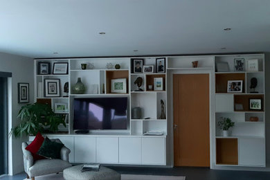 Large modern open plan living room with a wall mounted tv.