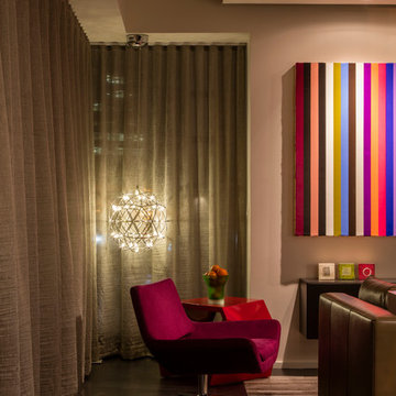 Floor-to-ceiling drapes provide privacy at night; whimsical lighting