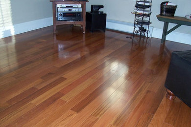 Living room - mid-sized traditional enclosed bamboo floor and brown floor living room idea in Boston with a music area, gray walls, no fireplace and no tv