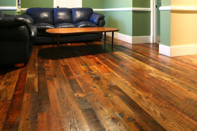 Mid-sized enclosed medium tone wood floor living room photo in Cincinnati