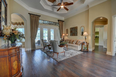 Mid-sized transitional formal and open concept dark wood floor and brown floor living room photo in Orlando with beige walls, no fireplace and no tv