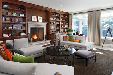 Example of a large classic formal and enclosed living room design in San Francisco with gray walls, a standard fireplace, a wood fireplace surround and no tv