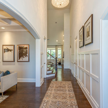 Foyer, Conversation Room & Music Room. Two fabulous chandeliers bring scale to a