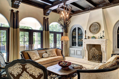 Inspiration for a large french country formal and enclosed living room remodel in Austin with beige walls, a standard fireplace, a stone fireplace and no tv