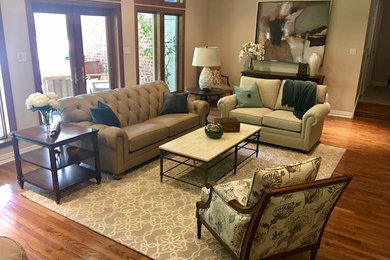 Inspiration for a mid-sized transitional open concept medium tone wood floor living room remodel in Dallas with beige walls