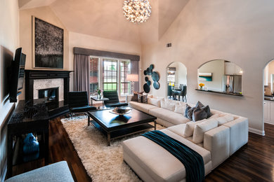 Large transitional enclosed dark wood floor and brown floor living room photo in Dallas with beige walls, a corner fireplace, a stone fireplace and a wall-mounted tv