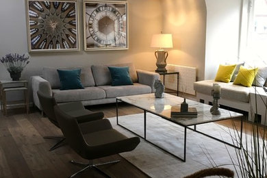 Medium sized contemporary living room in London with grey walls, dark hardwood flooring and brown floors.