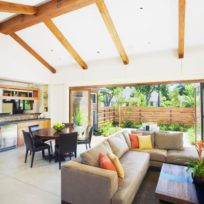 Example of a trendy open concept concrete floor living room design in San Francisco with white walls