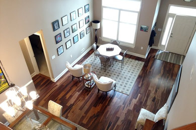 Mid-sized transitional open concept dark wood floor and brown floor living room photo in Philadelphia with beige walls and no fireplace