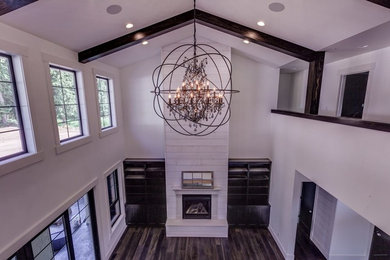 Inspiration for a large contemporary formal and open concept dark wood floor living room remodel in Seattle with gray walls and a standard fireplace