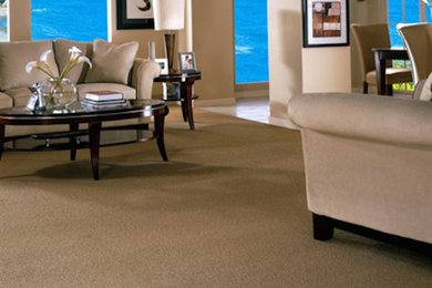 Example of a trendy open concept carpeted living room design in Denver with beige walls