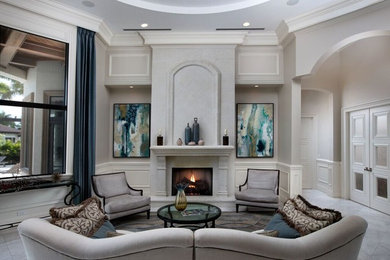 Example of a large classic formal and enclosed marble floor and gray floor living room design in Miami with gray walls, a standard fireplace, a stone fireplace and no tv