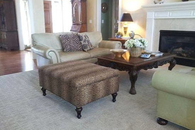 Traditional living room in Columbus with carpet, a standard fireplace and a stone fireplace surround.